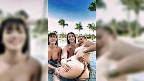 Three topless busty brunettes playfully fondle pregnant woman's big belly in pool