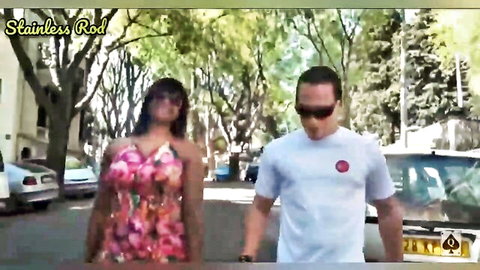 Lasika Indian wife in pink floral dress walking with French man outdoors