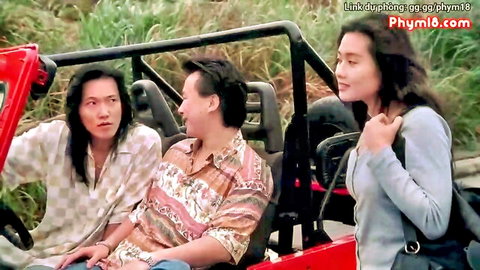 Asian trio in red jeep outdoors, casual clothed adventure