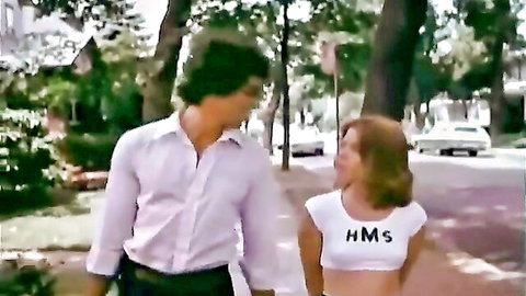 Vintage couple holding hands outdoors in Debbie Does Dallas 1978