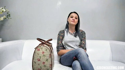 Lucie in casual jeans and cardigan on CzechCasting couch