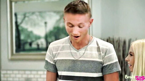 Smiling blonde babe leans in close to surprised young blonde guy wearing striped shirt
