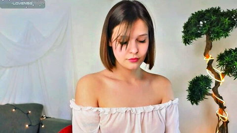 EthalGold webcam girl in off-shoulder white top, cleavage tease