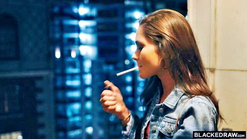 Zoe Bloom smoking seductively in denim jacket, wet hair, blue neon glow