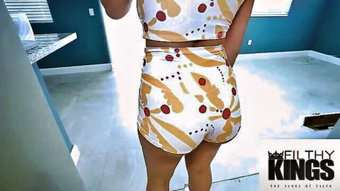 Brunette Ralph Simons in revealing shorts showing off her curvy ass