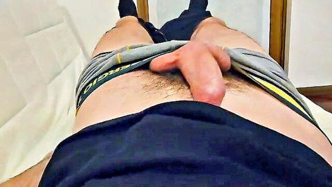 Hung Italian man exposes massive erect cock from gray underwear
