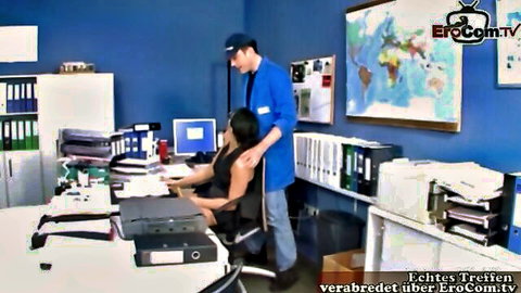 German office roleplay: man in uniform embraces Asian woman at desk