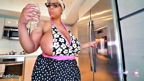 Brija Monet ebony BBW in revealing polka dot bikini holding coffee glass