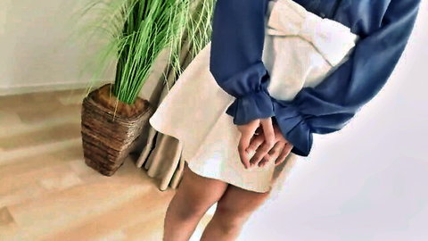 Flat-chested Japanese girl in navy blue blouse with bow and short white skirt