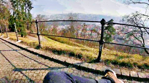 Marica Chanelle sitting in scenic park overlook, casual outdoor view
