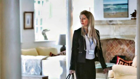 Anissa Kate as blonde businesswoman in blazer and pants, elegant pose
