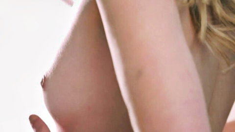 Dez Hansen topless blonde with hand touching her exposed nipples