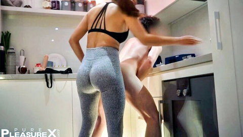 Redhead in tight leggings and sports bra teases nude man in intimate kitchen encounter