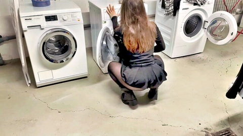 Amateur stepsister in black mini skirt and stockings bends over washing machine, teasing ass view