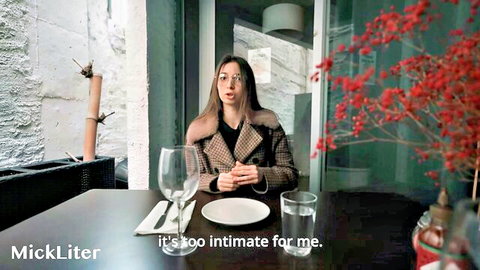 Brunette sugar baby in glasses at intimate dinner table talk