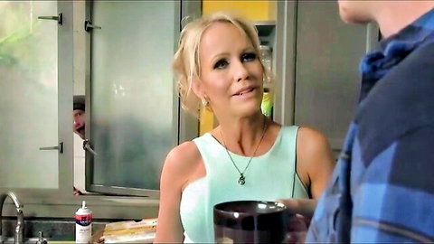 Blonde MILF stepmom in green tank top chatting in kitchen