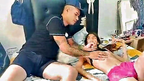 Tattooed stepbrother groping topless stepsister's tits on bed