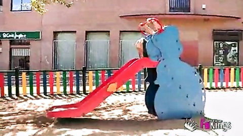 Chubby 18yo Alba in blue outfit on outdoor playground slide