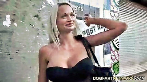 Cindy Sun, blonde with big tits, in black top and purse, teasing for interracial DP action