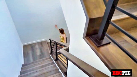 Coco Lovelock petite blonde in tight yellow dress walking up stairs