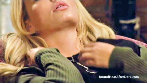 Blonde submissive babe in torn green sweater with BDSM collar teasing cleavage