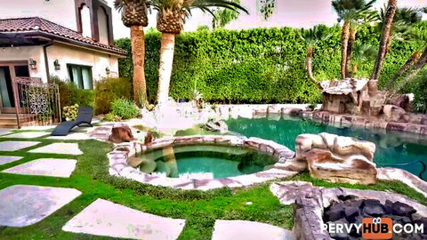 Luxurious backyard pool with palm trees and lounge chair ready for outdoor fucking