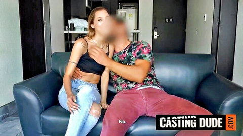 Blonde babe in black top grabs casting dude's thigh on couch