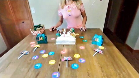 Blonde teen in sheer pink top celebrates 18th birthday with cake and gifts