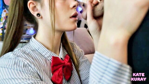 Brunette schoolgirl cosplay babe with red bowtie sucking cock closeup blowjob
