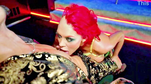 Pink-haired vixen sucks exposed tits in neon-lit strip club