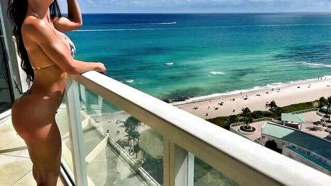 Misslexa in skimpy bikini on beach balcony, athletic body and ocean view