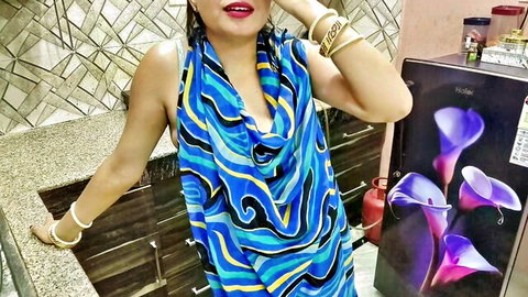 Indian bhabhi seducing with milky boobs in revealing blue dress