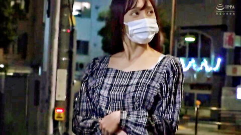 Japanese woman in checkered dress and mask stands outdoors at night, JAV onsen friends tease