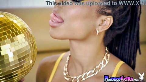 Kira Noir glamorous black diva teasing tongue out in yellow top