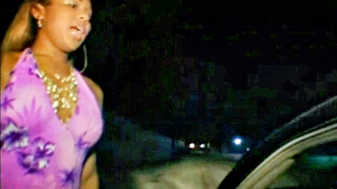 Ebony beauty in revealing purple dress teasing by car at night