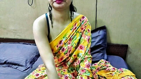 Seductive Indian bahu in yellow floral saree, shoulder exposed, wet hair
