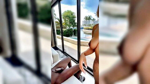 Curvy ebony Tink giving handjob to man by window, big tits nude view