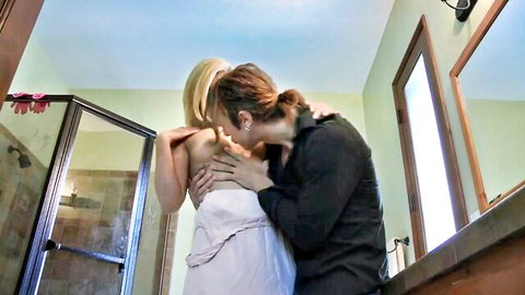 Blonde step-sister passionately embraced and kissed by redhead in intimate bathroom scene