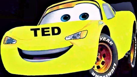 Smiling yellow cartoon race car with TED logo on hood and side Goodyear tires