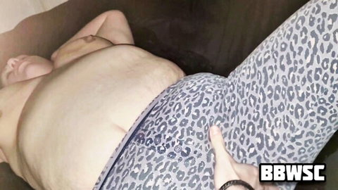 BBW with big tits and fat ass lies nude spreading shaved pussy cheeks in leopard leggings homemade amateur