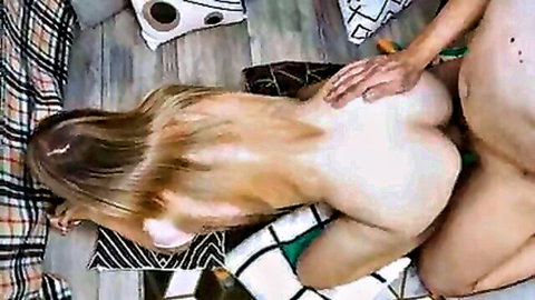 Blonde with long hair bent over doggy style on living room floor as guy grabs her pale ass exposing shaved pussy