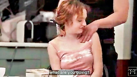 Man gropes redhead babe's tit over shiny pink dress in kitchen