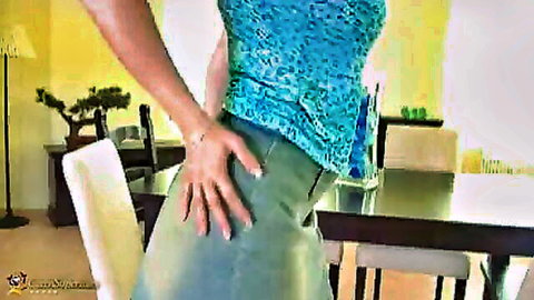Lea Magic MILF in blue top and tight skirt pose