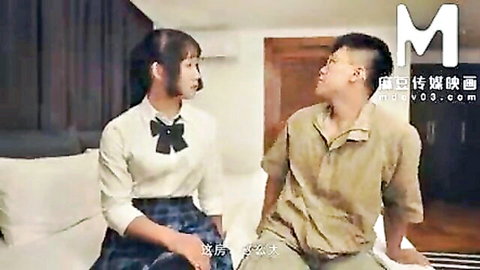 Asian schoolgirl in uniform chats seductively with man in bedroom setup