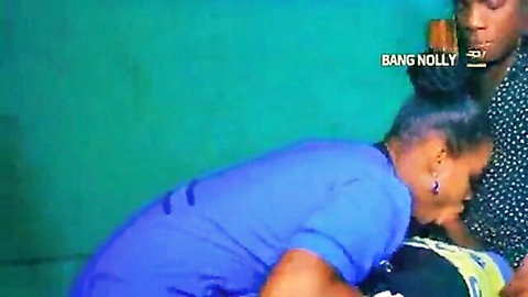 Ebony night shift nurse in forbidden lesbian romance with patient, intimate bending pose