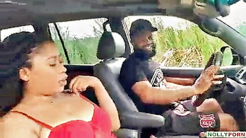 Sexy ebony woman in red bra lounging in car with driver, outdoor pickup vibe