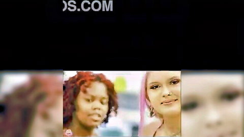 Red afro babe and pink-haired clown girl smiling seductively together