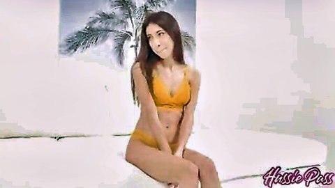 Petite brunette in skimpy yellow bikini teasing small tits and puffy pussy on bed