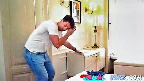 Handsome man bending over in tight jeans and white t-shirt, teasing pose