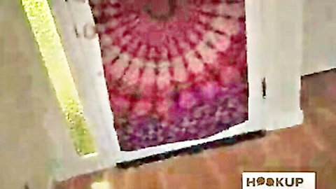 Open white door revealing pink mandala tapestry hanging inside cozy room entrance